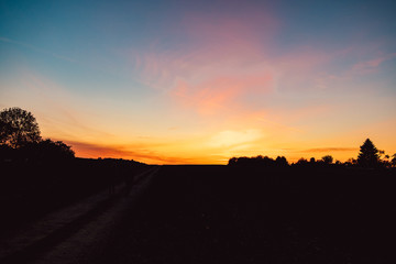 Fototapeta na wymiar sunset over a wide field