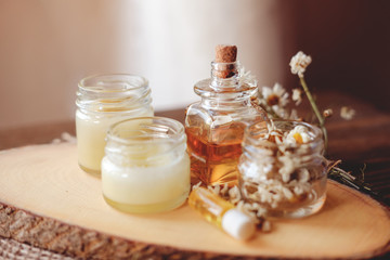 Hand cream and lip balm in a glass jar. Natural organic cosmetics with honey, wax and oils.