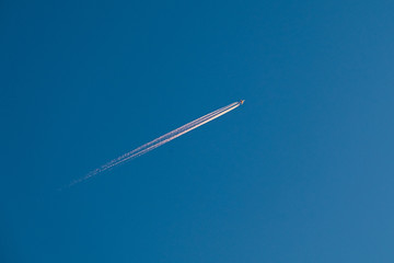flying airplane on blue sky