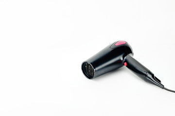 Hair dryer on white mat background with copy space