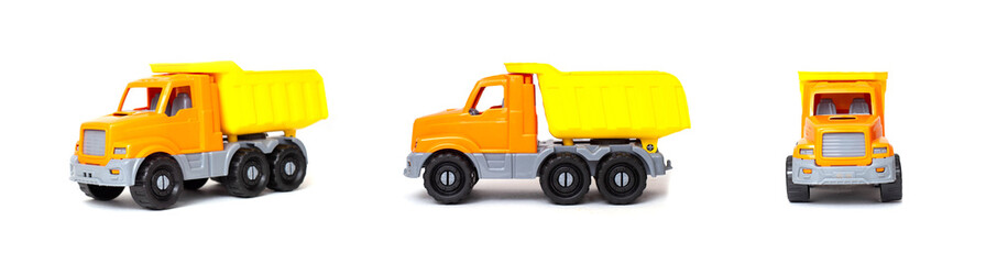 Small orange toy dump truck lorry on a white background, isolate