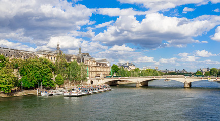 Fototapeta na wymiar Panoramic cityscape of Seine river and Paris, France, Europe. Seine is famous tourist destination with many landmarks. View of Seine postcard in Paris