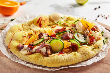 Pita with duck fillet and vegetables on craft paper