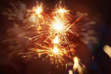 Abstract background blurry firework pyrotechnics and bokeh on the dark background for celebration concept