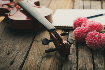 Close-up shot violin orchestra instrumental with vintage tone processed over wooden background select focus shallow depth of field