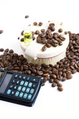 Body brush, coffee beans, oil and calculator on white background