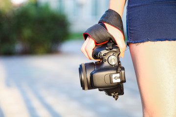 Girl photographer with reflex camera