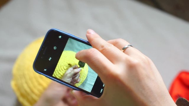 smartphone screen on which a photograph of a marijuana bud is taken