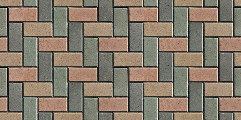 The surface is lined with colorful road tiles - paving stone. View from above. Specially prepared background for seamless shading.