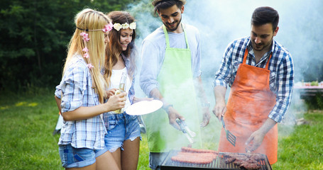 Group of friends making barbecue
