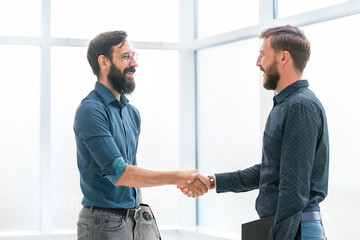 financial partners shaking hands . concept of cooperation