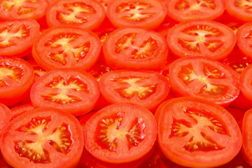 Sliced tomato background. Top view.