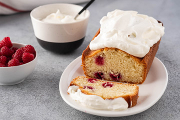 Cake with raspberries and whipped cream. Copy space.