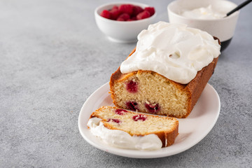 Cake with raspberries and whipped cream. Copy space.