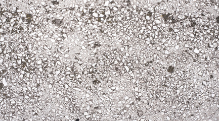 Cement and Concrete texture for pattern and background.  Grungy wall background with cracks, stones and paint. 