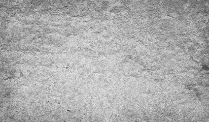 Cement and Concrete texture for pattern and background.  Grungy wall background with cracks, stones and paint. 