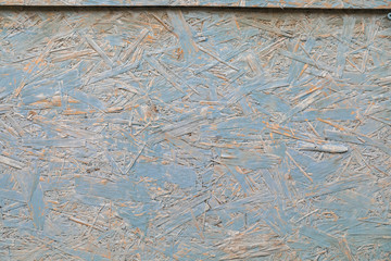 The background of the wall of pressed wooden chips is painted blue. Windy Grange Surface