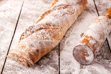 Hot french bagette on roustic wrap in boulangerie. Bred, food, closeup