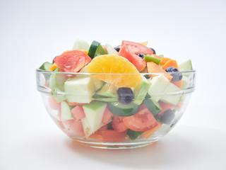 Mixed fruit and vegetable salad in a glass bowl