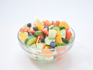 Mixed fruit and vegetable salad in a glass bowl