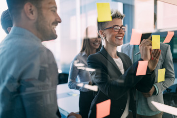 Group of coworkers working together on business project in modern office