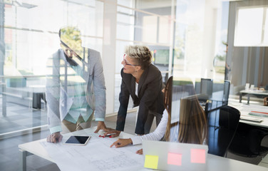 Group of coworkers working together on business project in modern office