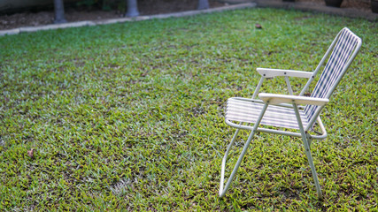 Blue and white lawn chair on grass