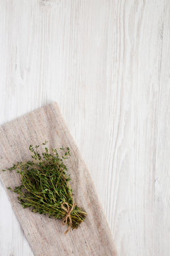 Raw organic fresh thyme on cloth, top view. Flat lay, overhead, from above. Space for text.