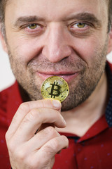 Man having bitcoin coin