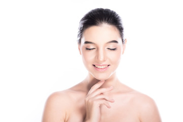 Beauty woman face isolate in white background. Young caucasian girl, perfect skin, cosmetic, spa, beauty treatment concept. One finger on chin, close eye, big smile.