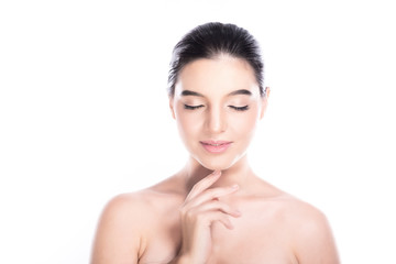 Beauty woman face isolate in white background. Young caucasian girl, perfect skin, cosmetic, spa, beauty treatment concept. One finger on chin, close eye, smile.