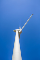 View of a wind turbine on top of mountains