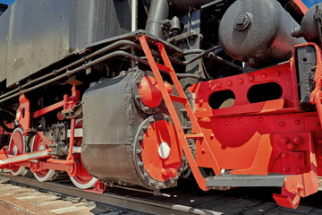 Fragment of an old steam locomotive on a rail