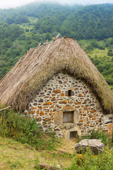 Fototapeta na wymiar La Pornacal hiking route in Somiedo natural park, Spain, with straw roof houses