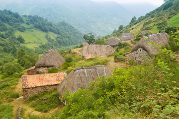 La Pornacal hiking route in Somiedo natural park, Spain, with straw roof houses
