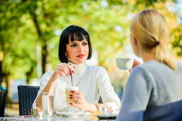 Conversation women cafe terrace. Friendship friendly relations. Discussing rumors. Trustful communication. Friendship sisters. Friendship meeting. Closest people. Girls friends drink coffee talk