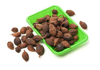 Black cardamom on a white background 