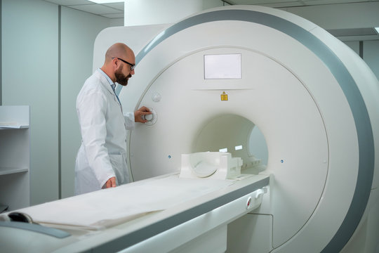 Doctor preparing MRI scanner in a hospital