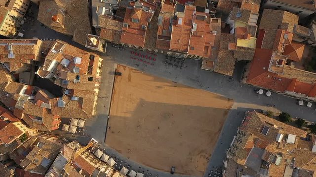 top aerial view to Placa Major in Catalonia Vic city. Spain/ Video footage. Summer sunset light