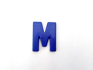 plastic alphabet letters isolated on white background