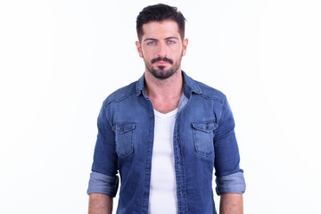 Fototapeta premium Young handsome bearded hipster man looking at camera