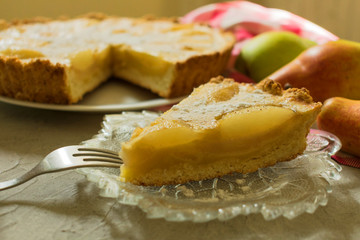 A piece of pear tart. Autumn pear cake. Close-up.
