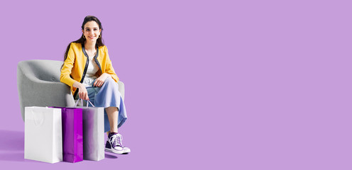 Happy woman sitting on an armchair after shopping