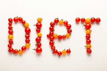 Red and yellow cherry tomatoes, fresh bright organic vegetables. Vegetable diet, healthy nutrition.