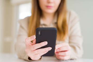 Fototapeta na wymiar Close up of woman using smartphone