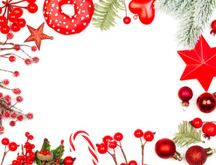 Christmas and New Years holidays composition. Red holly berries, glass balls and green fir branch...