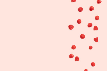 Pattern of raspberry on pink background. Flat lay. Top view. Food background with summer berries.