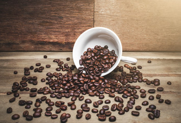 White coffee mugs that put coffee on the wood floor.