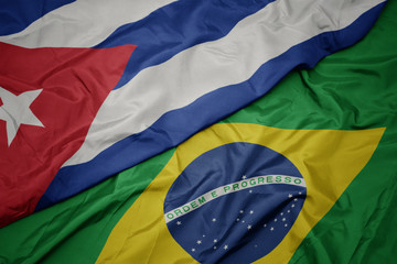 waving colorful flag of brazil and national flag of cuba.