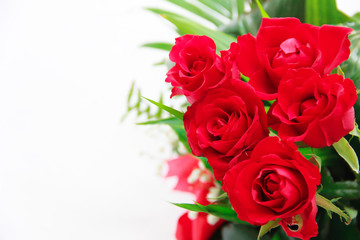 decorative bouquet of red natural roses with green a leaves